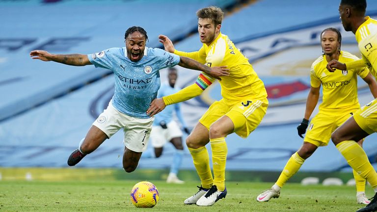 Raheem Sterling of Manchester City is fouled by Joachim Andersen of Fulham, leading to Manchester City being awarded a penalty