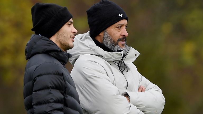 Raul Jimenez watches Wolves training with Nuno Espirito Santo