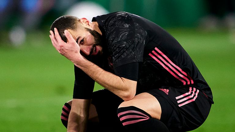 Karim Benzema slumps to the ground after Real Madrid's disappointing draw