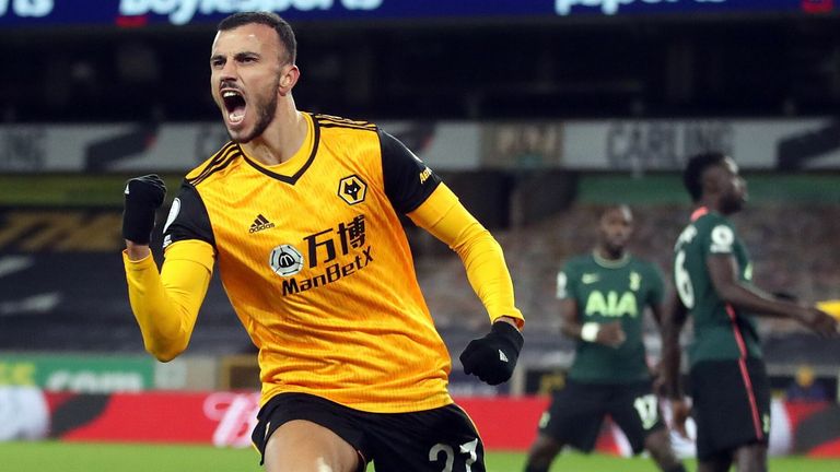 Romain Saiss wheels away in celebration after scoring a late equaliser