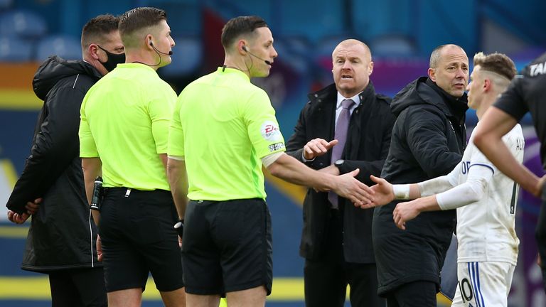 Sean Dyche speaks to the referee after Burnley's defeat at Leeds
