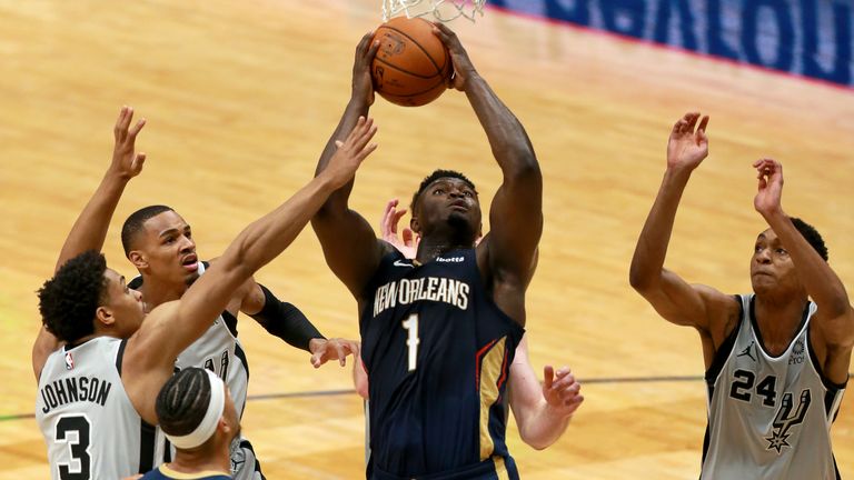 Zion Williamson #1 of the New Orleans Pelicans pulls down a rebound during a game against the San Antonio Spurs at Smoothie King Center