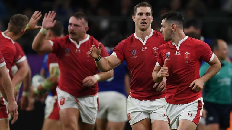 Wales' players react after Wales' back row Ross Moriarty scored a try during the Japan 2019 Rugby World Cup quarter-final match between Wales and France at the Oita Stadium in Oita on October 20, 2019. (Photo by CHARLY TRIBALLEAU / AFP) (Photo by CHARLY TRIBALLEAU/AFP via Getty Images)