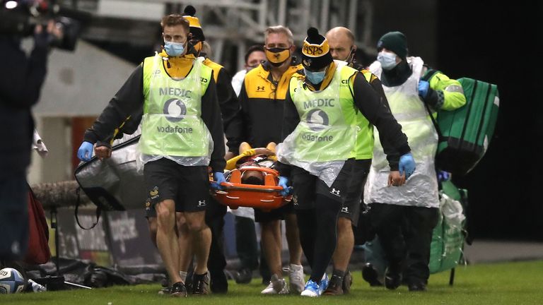 Wasps' Zach Kibirige is carried off on a stretcher after needing lengthy treatment on the field