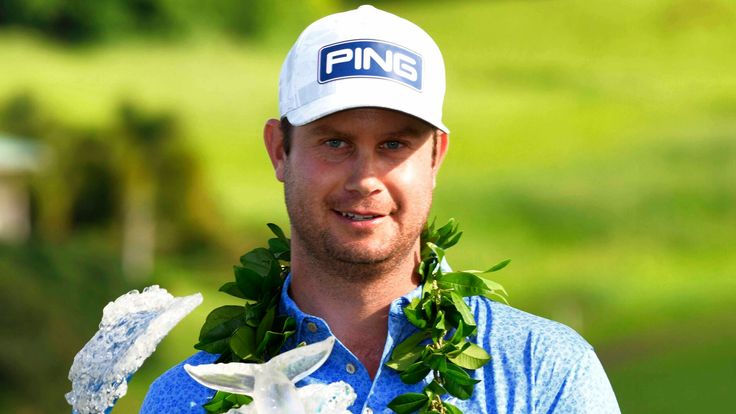 Harris English holds the champions trophy after the final round of the Tournament of Champions golf event, Sunday, Jan. 10, 2021, at Kapalua Plantation Course in Kapalua, Hawaii. (Matthew Thayer/The Maui News via AP)