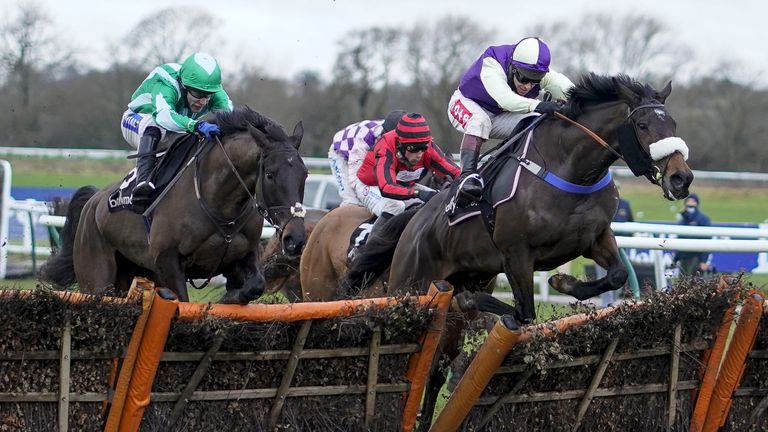 Adrimel ridden by Richard Johnson (right) clears the last to win The Ballymore Leamington Novices' Hurdle at Warwick Racecourse.