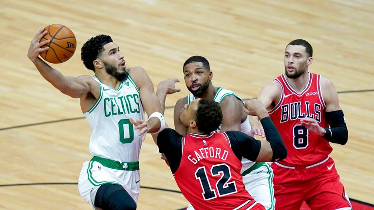 AP - Boston Celtics&#39; Jayson Tatum (0) shoots over Chicago Bulls&#39; Daniel Gafford (12) during the first half of an NBA basketball game, 