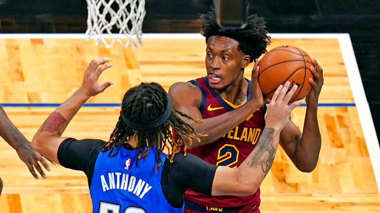 AP - Cleveland Cavaliers guard Collin Sexton, right, looks to pass the ball as he is guarded by Orlando Magic guard Cole Anthony (50)