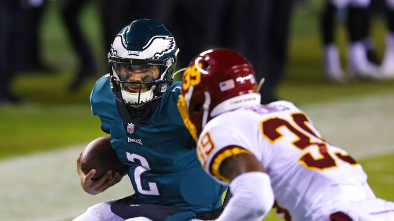 AP - Philadelphia Eagles&#39; Jalen Hurts (2) runs for a six yard touchdown as Washington Football Team&#39;s Jeremy Reaves (39) defends during the second quarter of an NFL football game against the Washington Football Team