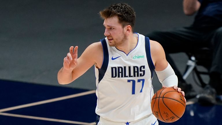 Dallas Mavericks guard Luka Doncic (77) brings the ball up court against the Denver Nuggets during the second quarter of an NBA basketball game Thursday, Jan. 7, 2021, in Denver. 