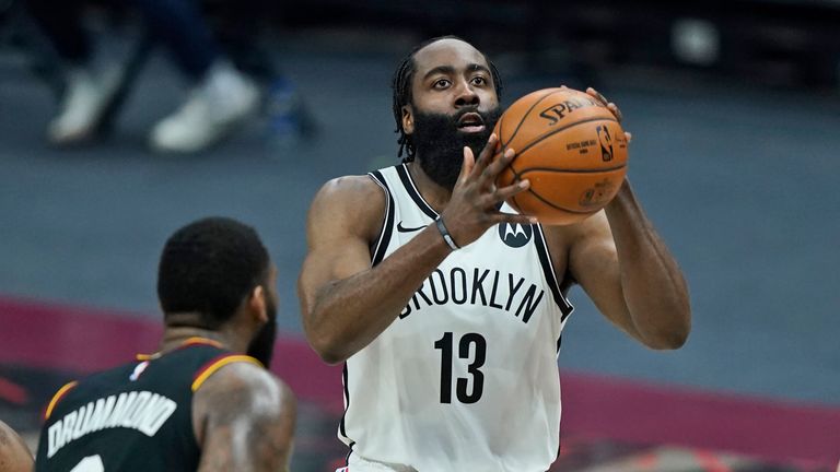Brooklyn Nets&#39; James Harden (13) shoots against the Cleveland Cavaliers during the second half of an NBA basketball game, Wednesday, Jan. 20, 2021, in Cleveland.
