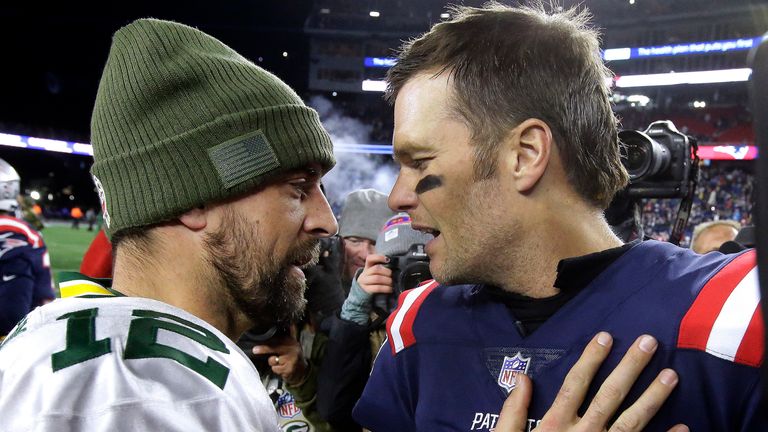 Green Bay Packers quarterback Aaron Rodgers and a then-New England Patriots Tom Brady speak at midfield after facing off in November 2018. (AP Photo/Steven Senne)