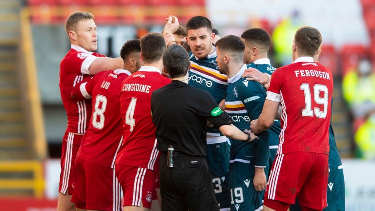 The two sets of players clash during the Scottish Premiership match