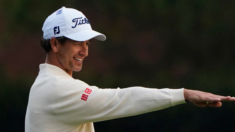 Adam Scott, of Australia, discusses his shot on the second fairway during the final round of the Masters golf tournament Sunday, Nov. 15, 2020, in Augusta, Ga. (AP Photo/Matt Slocum)