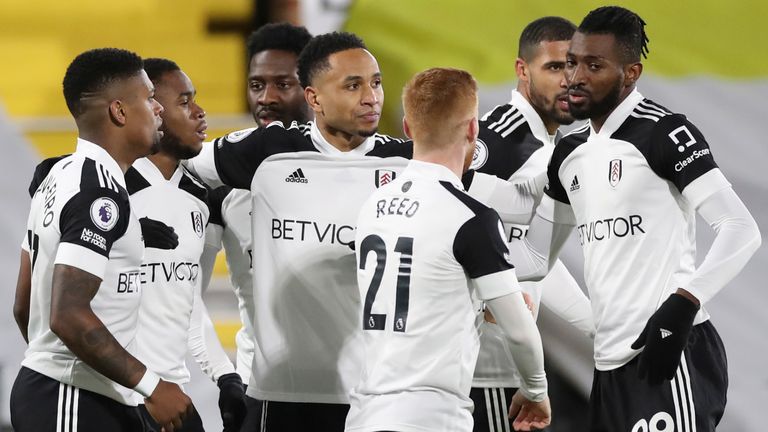 Ademola Lookman celebrates with team-mates after scoring for Fulham against Man Utd