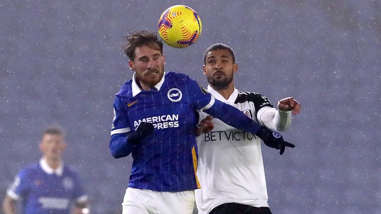 Alexis Mac Allister and Ruben Loftus-Cheek battle for the ball