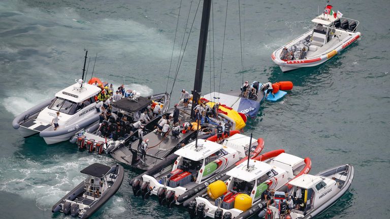 New York Yacht Club American Magic's race boat PATRIOT being assisted on the water after the capsize (Image Credit - COR 36 | Studio Borlenghi)