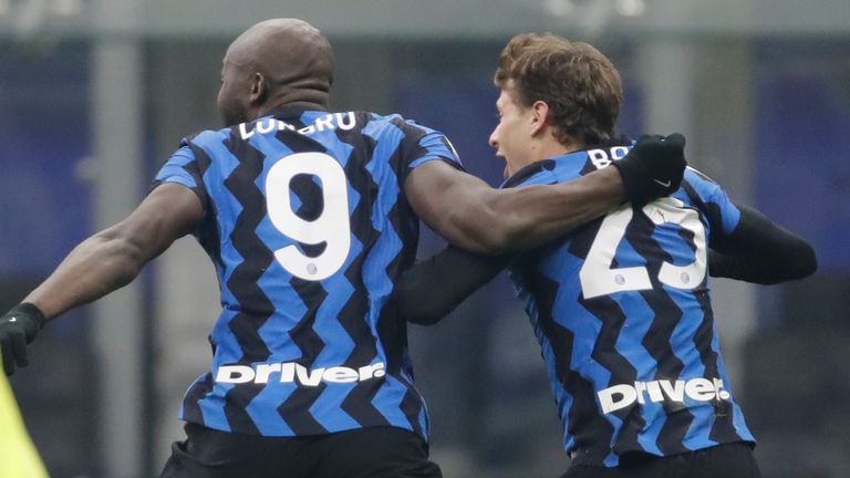 Inter Milan's Nicolo Barella, right, celebrates after scoring his side's second goal during a Serie A soccer match between Inter Milan and Juventus at the San Siro stadium in Milan, Italy, Sunday, Jan. 17, 2021. (AP Photo/Luca Bruno)