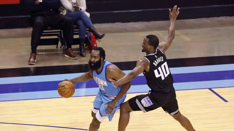 James Harden scored 33 points as the Houston Rockets edged out the Sacramento Kings for their first win of the season.