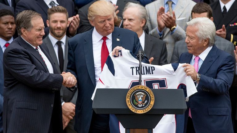President Donald Trump was presented with a New England Patriots jersey by Patriots head coach Bill Belichick (L) and New England Patriots owner Robert Kraft (R) back in 2017
