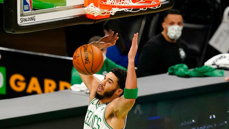 AP - Boston Celtics forward Jayson Tatum (0) dunks in the first quarter of an NBA basketball game against the Washington Wizards,