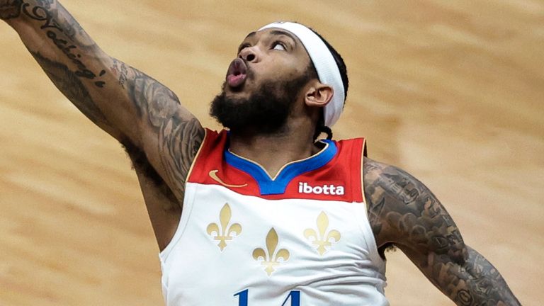 Brandon Ingram looks to block a shot from the Hornets' Gordon Hayward (AP Photo/Derick Hingle)
