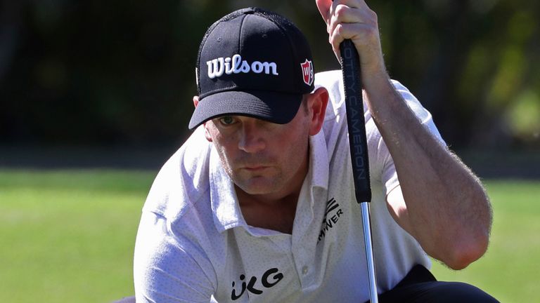 Brendan Steele lines up his putt on the 9th green during the third round at the Sony Open golf tournament Saturday, Jan. 16, 2021, in Honolulu.  (AP Photo/Marco Garcia)