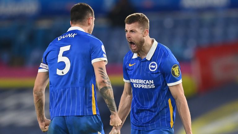 Brighton and Hove Albion's Lewis Dunk (left) and Adam Webster celebrate victory at Leeds