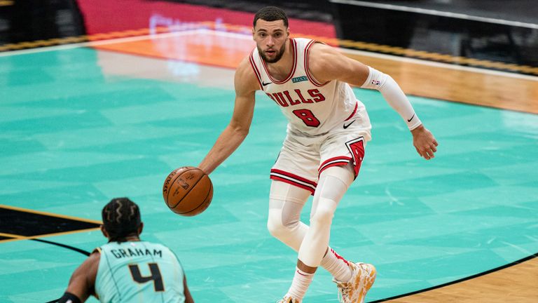 Chicago Bulls guard Zach LaVine (8) brings the ball up court against the Charlotte Hornets during an NBA basketball game in Charlotte, N.C., Friday, Jan. 22, 2021. (AP Photo/Jacob Kupferman)