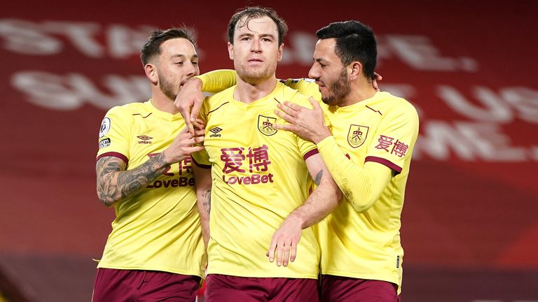 Ashley Barnes (centre) celebrates scoring for Burnley against Liverpool