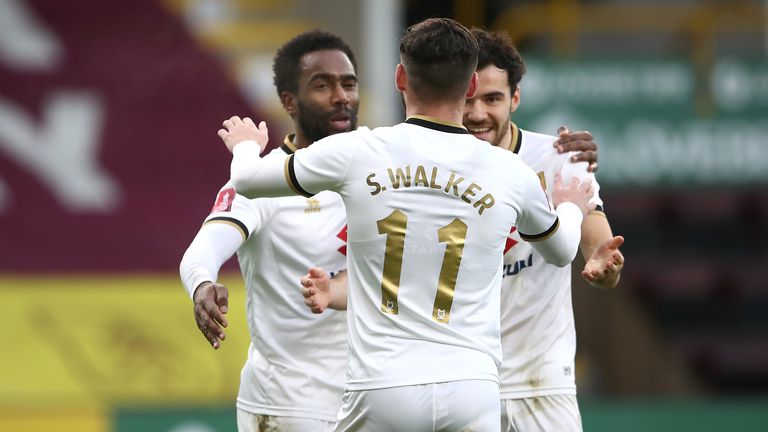 Veteran forward Cameron Jerome (left) put MK Dons ahead at Turf Moor