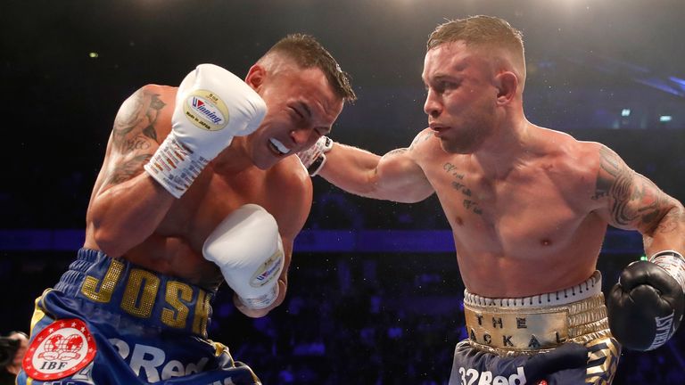 Carl Frampton (right) and Josh Warrington in action in the World Featherweight Championship at Manchester Arena in December  2018