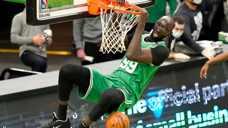 Boston Celtics center Tacko Fall (99) dunks during the fourth quarter of an NBA basketball game against the Orlando Magic
