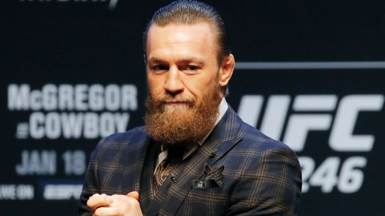Conor McGregor motions to the crowd during a news conference for a UFC 246 mixed martial arts bout, Wednesday, Jan. 15, 2020, in Las Vegas. McGregor is scheduled to fight Donald &#34;Cowboy&#34; Cerrone in a welterweight bout Saturday. (AP Photo/John Locher)