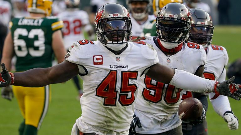 Tampa Bay Buccaneers' Devin White celebrates after picking up a fumble by the Green Bay Packers' Aaron Jones in the NFC Championship game. (AP Photo/Mike Roemer)..