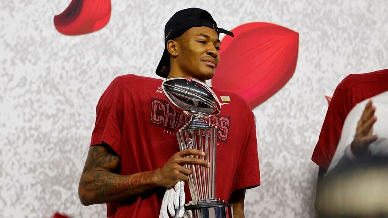 Alabama wide receiver DeVonta Smith holds the trophy after their win against Notre Dame in the Rose Bowl NCAA college football game