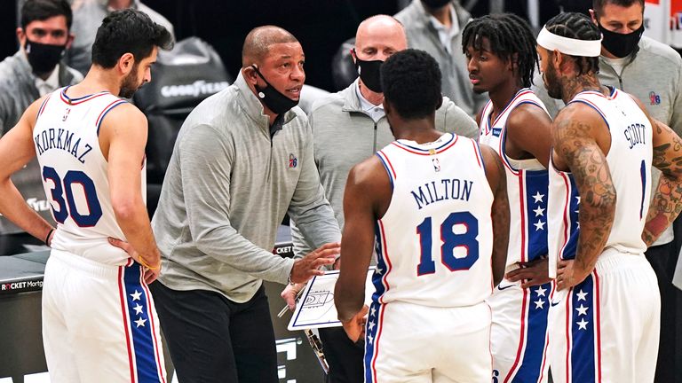 Philadelphia 76ers head coach Doc Rivers talks with players during a time-out in the first half of an NBA basketball game against the Cleveland Cavaliers
