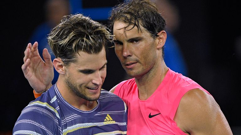 Austria's Dominic Thiem, left, is congratulated by Spain's Rafael Nadal after winning their quarterfinal match at the Australian Open tennis championship in Melbourne, Australia, Wednesday, Jan. 29, 2020. (AP Photo/Andy Brownbill)