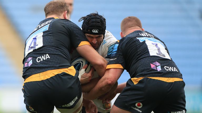 Wasps' Tom West (right) and Joe Launchbury tackle Don Armand of Exeter Chiefs