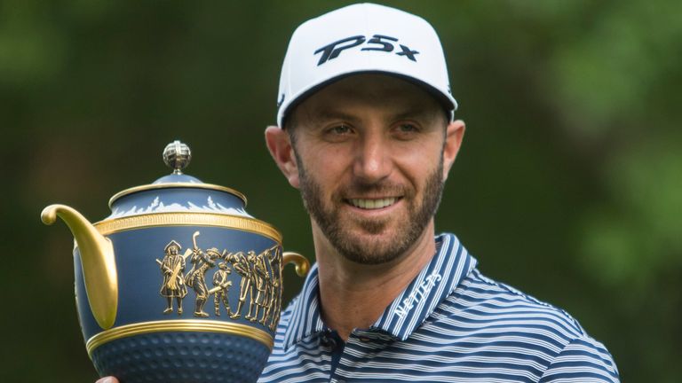 Dustin Johnson poses with his Mexico Championship trophy at the Chapultepec Golf Club in Mexico City, Sunday, Feb. 24, 2019. (AP Photo/Christian Palma)