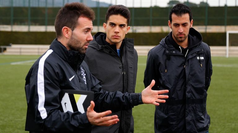 Former Crawley assistant Edu Rubio, seen here with Sergio Busquets, is now working as a technical consultant in Crystal Palace&#39;s academy