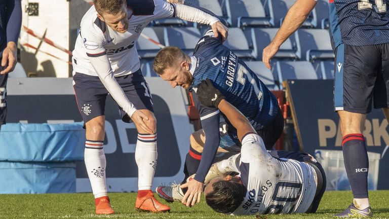 Ross County's Michael Gardyne collides with Rangers' Alfredo Morelos