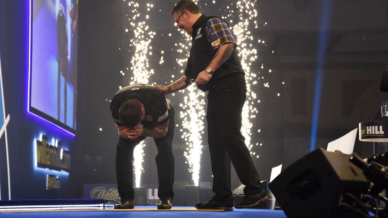 Gary Anderson congratulates Gerwyn Price after the Welsman become world champion for the first time