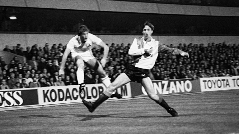 Glenn Hoddle of Tottenham whips in a cross as Feyenoord's Johan Cruyff defends in the 1984 UEFA Cup second-round clash between the sides