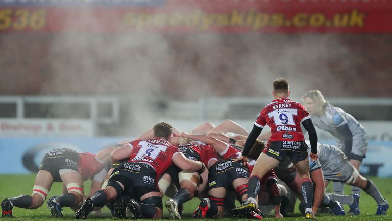 The two sets of forwards pack down for a scrum at Kingsholm