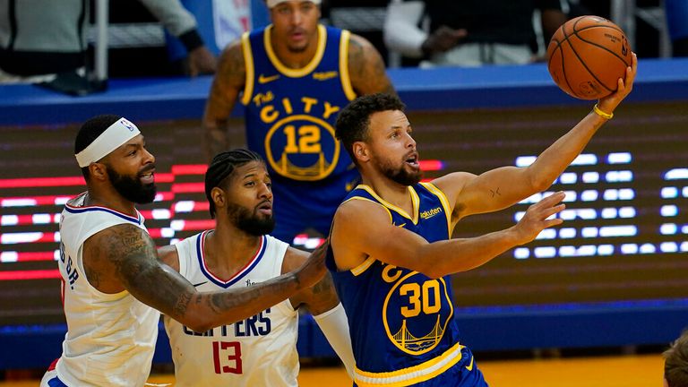 AP - Golden State Warriors guard Stephen Curry (30) shoots against Los Angeles Clippers&#39; Marcus Morris Jr., left, and Paul George 