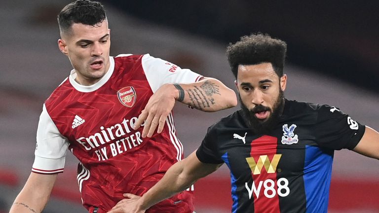 Andros Townsend is marked closely by Arsenal's Granit Xhaka