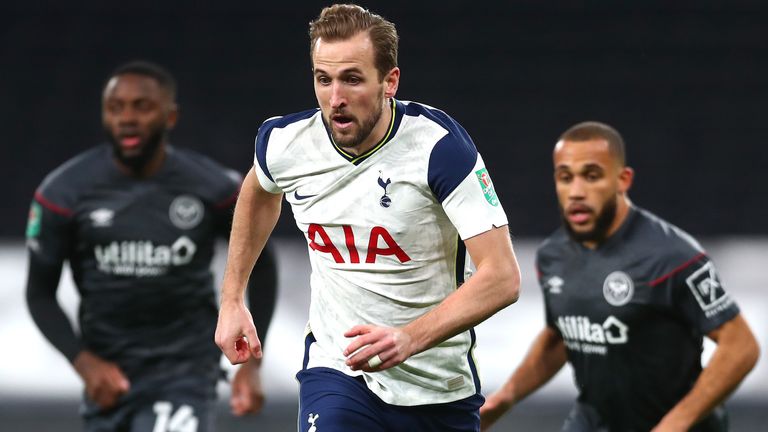 Harry Kane is chased by two Brentford defenders during the Carabao Cup semi-final