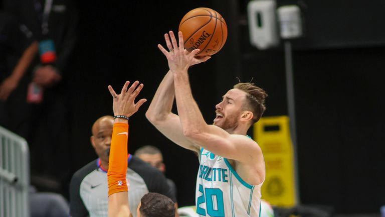 Charlotte Hornets forward Gordon Hayward (20) shoots over New York Knicks guard Austin Rivers in the first quarter of an NBA basketball game in Charlotte