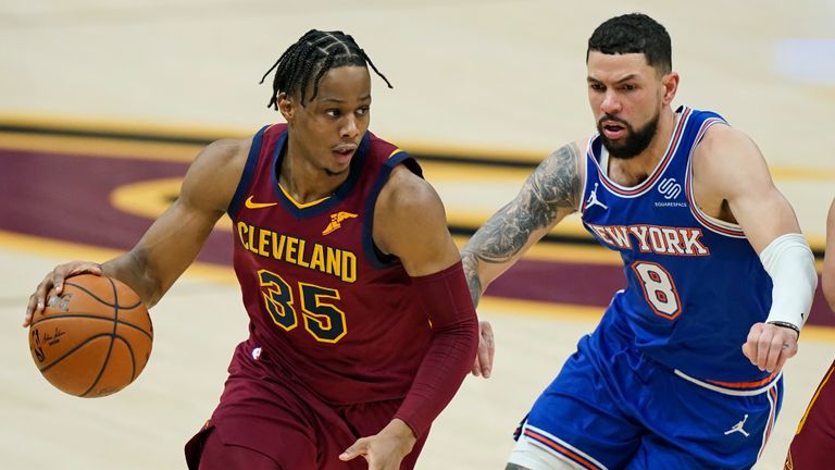 Cleveland Cavaliers&#39; Isaac Okoro (35) drives against New York Knicks&#39; Austin Rivers (8) in the first half of an NBA basketball game